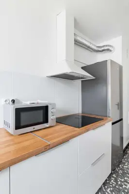 Cuisine ou kitchenette dans l'établissement Appartement Paisible proche parc des princes - 4P