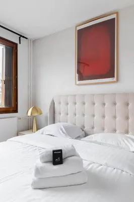Un ou plusieurs lits dans un hébergement de l'établissement Appartement Paisible proche parc des princes - 4P