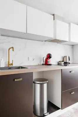 Cuisine ou kitchenette dans l'établissement 2 pieces Buttes chaumont parfait pour famille