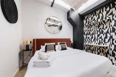 Un ou plusieurs lits dans un hébergement de l'établissement 2 pieces Buttes chaumont parfait pour famille