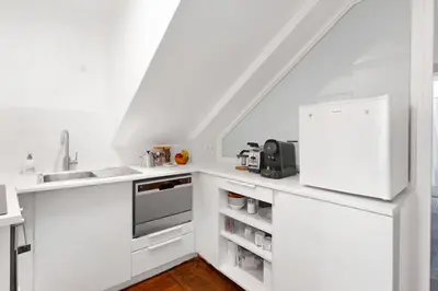 Cuisine ou kitchenette dans l'établissement Suite Beausire charme parisien au cœur du Marais
