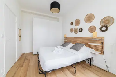 Un ou plusieurs lits dans un hébergement de l'établissement Appartement cosy refait a neuf - Paris 19 - 4P