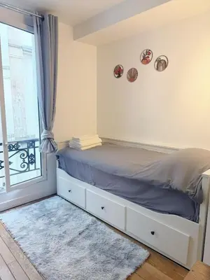 Un ou plusieurs lits dans un hébergement de l'établissement Modern Studio near Montmartre & Opéra