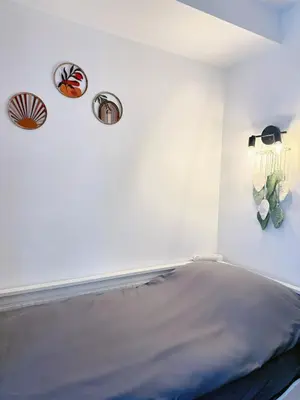 Un ou plusieurs lits dans un hébergement de l'établissement Modern Studio near Montmartre & Opéra