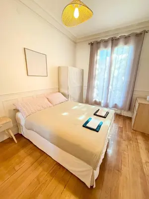 Un ou plusieurs lits dans un hébergement de l'établissement Parisian Apartment for 3 People - Paris Parc des Princes WiFi & Metro