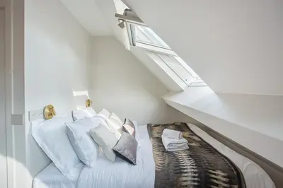 Un ou plusieurs lits dans un hébergement de l'établissement Appart'Hôtel Lou Suites