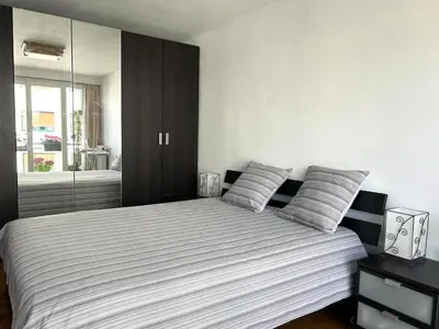 Un ou plusieurs lits dans un hébergement de l'établissement Vue sur la tour Eiffel, agréable appartement T2