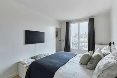 Un ou plusieurs lits dans un hébergement de l'établissement Charming Apartment 1 bedroom heart 16th in Paris