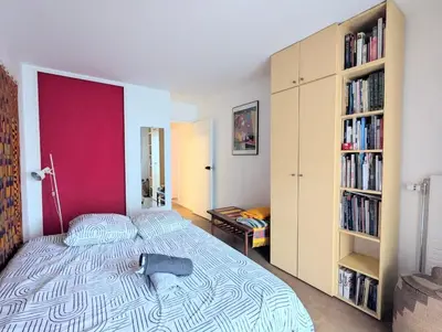 Un ou plusieurs lits dans un hébergement de l'établissement Grand appartement et cosy Paris