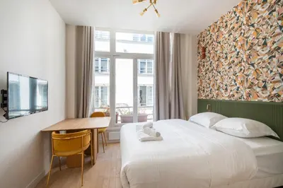 Un ou plusieurs lits dans un hébergement de l'établissement Spacious Cosy Apartment for 2 Bastille Paris