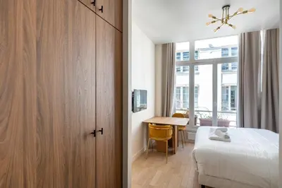 Un ou plusieurs lits dans un hébergement de l'établissement Spacious Cosy Apartment for 2 Bastille Paris