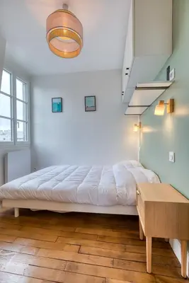 Un ou plusieurs lits dans un hébergement de l'établissement On Room Last Floor - Batignolles