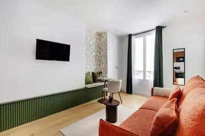 Télévision ou salle de divertissement dans l'établissement Appartements Ramey