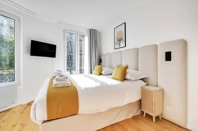 Un ou plusieurs lits dans un hébergement de l'établissement Appartements Ramey