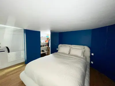 Un ou plusieurs lits dans un hébergement de l'établissement Design and Artistic Loft Marais