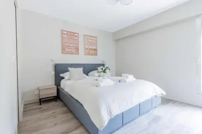 Un ou plusieurs lits dans un hébergement de l'établissement Superbe Appartement 1BDR - 2P Porte Maillot