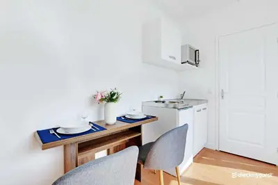Cuisine ou kitchenette dans l'établissement Cosy Studio 2P - Parc Expositions 15eme arr