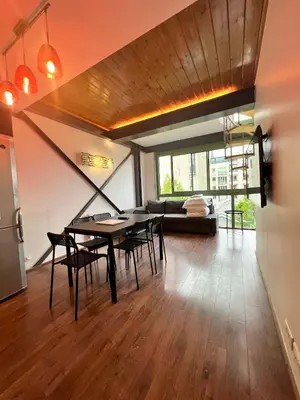Télévision ou salle de divertissement dans l'établissement Pere Lachaise Apartments
