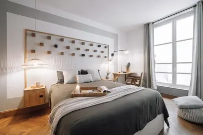 Un ou plusieurs lits dans un hébergement de l'établissement Lido - 1 chambre à Saint-Germain-des-Prés