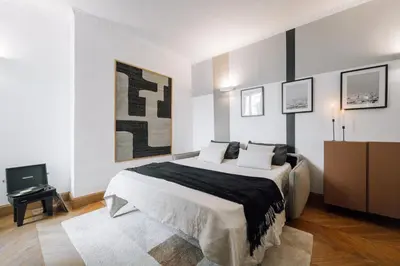 Un ou plusieurs lits dans un hébergement de l'établissement Lido - 1 chambre à Saint-Germain-des-Prés