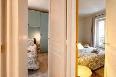 Un ou plusieurs lits dans un hébergement de l'établissement Luxury Flat Louvres 6 Guests
