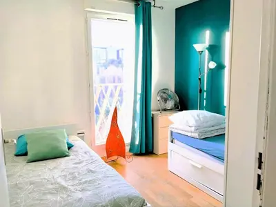 Un ou plusieurs lits dans un hébergement de l'établissement Close to Paris, Metro,RER, 6 People, PKG