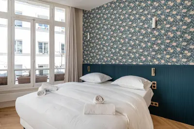 Un ou plusieurs lits dans un hébergement de l'établissement Chic Studio Apartment for 2 Near Bastille