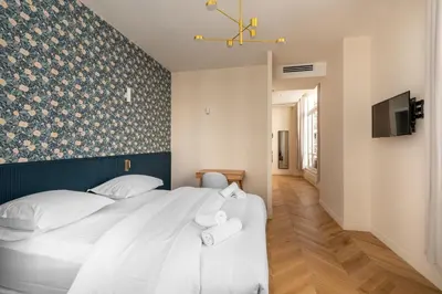 Un ou plusieurs lits dans un hébergement de l'établissement Chic Studio Apartment for 2 Near Bastille