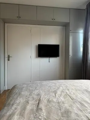 Un ou plusieurs lits dans un hébergement de l'établissement Courbevoie Apartment - HBA