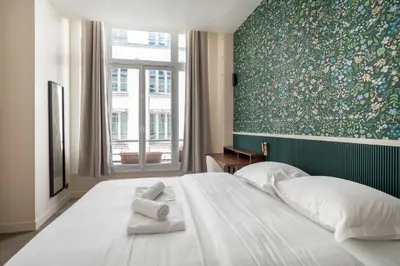 Un ou plusieurs lits dans un hébergement de l'établissement Chic Renovated 1BDR Apartment Near Bastille
