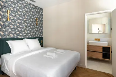 Un ou plusieurs lits dans un hébergement de l'établissement Cozy Paris Studio for 2 near Bastille