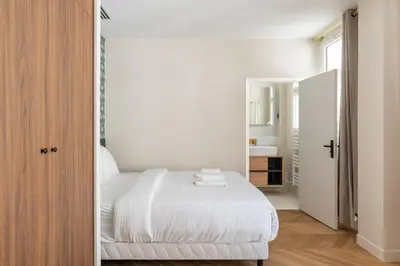 Un ou plusieurs lits dans un hébergement de l'établissement Cozy Paris Studio for 2 near Bastille