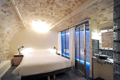 Un ou plusieurs lits dans un hébergement de l'établissement Unique loft apartment in Le Marais