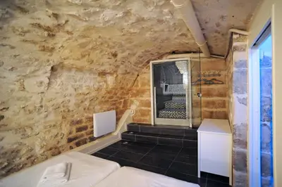 Un ou plusieurs lits dans un hébergement de l'établissement Unique loft apartment in Le Marais
