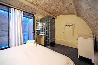 Un ou plusieurs lits dans un hébergement de l'établissement Unique loft apartment in Le Marais