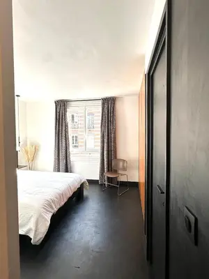 Un ou plusieurs lits dans un hébergement de l'établissement design apartment