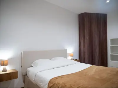 Un ou plusieurs lits dans un hébergement de l'établissement Cosy appartement Levallois