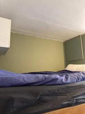 Un ou plusieurs lits dans un hébergement de l'établissement Studio lumineux Montparnasse
