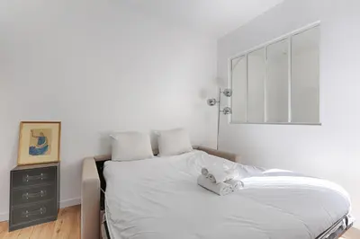 Un ou plusieurs lits dans un hébergement de l'établissement Appartement de charme entre Batignolles et Montmartre