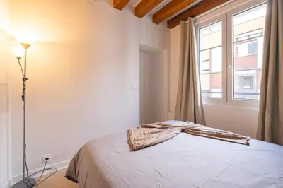 Un ou plusieurs lits dans un hébergement de l'établissement Elegant 1 BR - Palais Royal 2