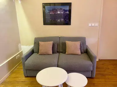 Coin salon dans l'établissement Brune - Appartement Paris 14e 4P