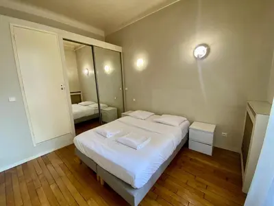 Un ou plusieurs lits dans un hébergement de l'établissement Brune - Appartement Paris 14e 4P