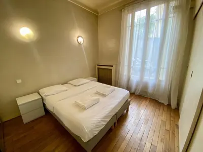 Un ou plusieurs lits dans un hébergement de l'établissement Brune - Appartement Paris 14e 4P