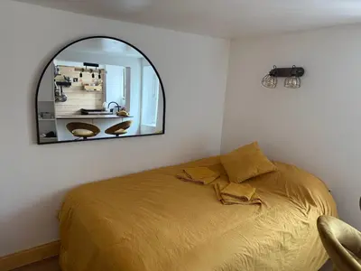 Un ou plusieurs lits dans un hébergement de l'établissement Appartement Paris 9