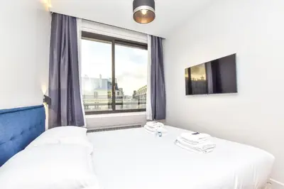Un ou plusieurs lits dans un hébergement de l'établissement Bright apartment - 1BR 4P - Opéra Garnier