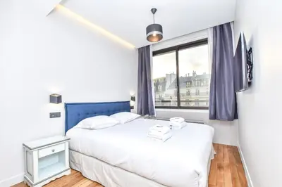 Un ou plusieurs lits dans un hébergement de l'établissement Bright apartment - 1BR 4P - Opéra Garnier