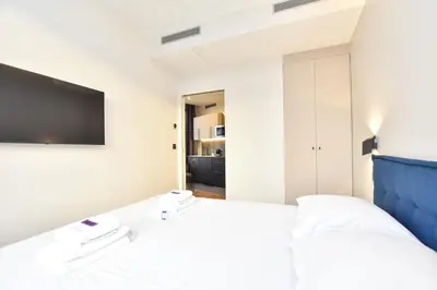 Un ou plusieurs lits dans un hébergement de l'établissement Bright apartment - 1BR 4P - Opéra Garnier