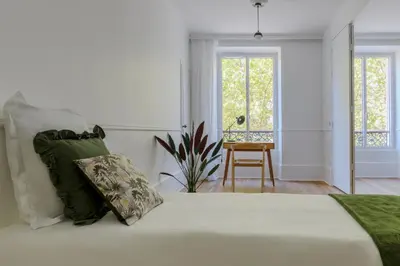 Un ou plusieurs lits dans un hébergement de l'établissement Paris Center Colisée residence