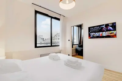 Un ou plusieurs lits dans un hébergement de l'établissement Modern apartment near Palais Garnier