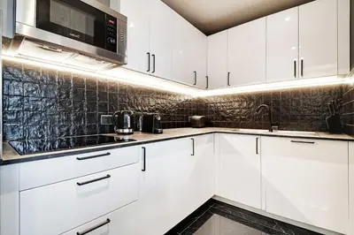 Cuisine ou kitchenette dans l'établissement Modern apartment near Palais Garnier